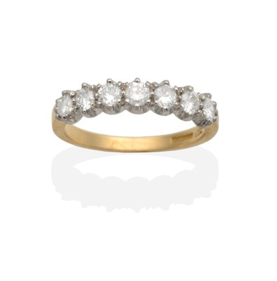 Lot 2061 - An 18 Carat Gold Diamond Half Hoop Ring, seven round brilliant cut diamonds in claw settings,...