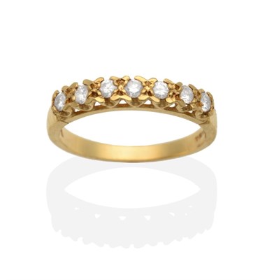 Lot 2065 - An 18 Carat Gold Diamond Half Hoop Ring, seven round brilliant cut diamonds in claw settings,...