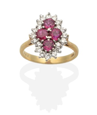 Lot 2070 - A Ruby and Diamond Cluster Ring, four round cut rubies in claw settings, within a kite-shaped...