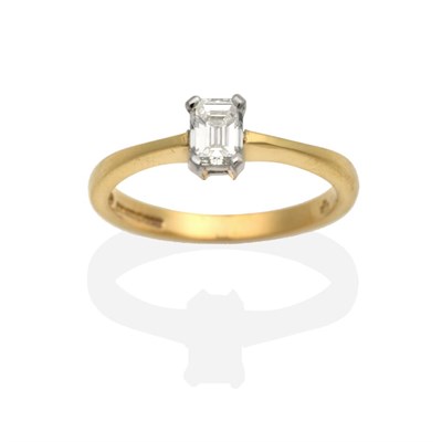 Lot 2073 - An 18 Carat Gold Octagonal Cut Solitaire Diamond Ring, in a claw setting, to knife edge...