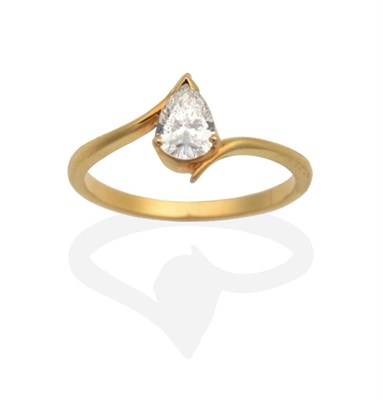 Lot 2078 - A Pear Cut Solitaire Diamond Ring, in a claw setting, to bypass shoulders, estimated diamond weight