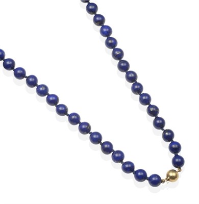 Lot 2080 - A Lapis Lazuli Bead Necklace, uniform lapis lazuli beads knotted to a ball clasp, length 48cm...