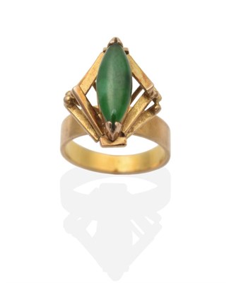 Lot 2097 - A Jade Ring, a marquise cabochon jade in a claw setting, within a high set kite-shaped bar...