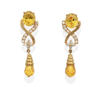 Lot 2108 - A Pair of Yellow Zircon and Diamond Earrings, an oval cut yellow zircon in a claw setting...