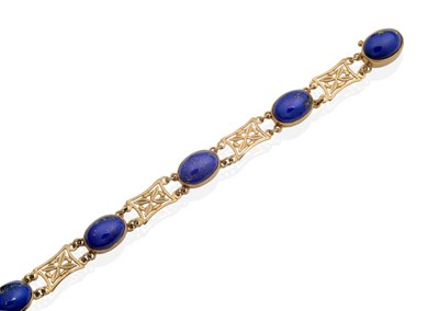 Lot 2110 - A 9 Carat Gold Lapis Lazuli Bracelet, five oval cabochon lapis lazuli, in rubbed over settings,...