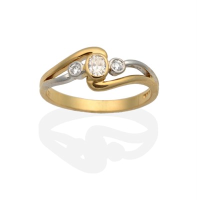 Lot 2117 - An 18 Carat Two Colour Gold Diamond Three Stone Ring, an oval cut diamond spaced by round brilliant