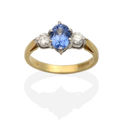 Lot 2124 - An 18 Carat Gold Sapphire and Diamond Three Stone Ring, an oval cut sapphire in a claw setting,...