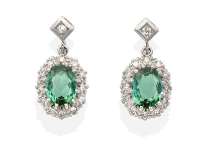 Lot 2132 - A Pair of Green Tourmaline and Diamond Cluster Earrings, an eight-cut diamond in a square...