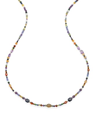 Lot 2134 - A Multi-Gemstone Rope Necklace, faceted and polished beads of tanzanite, orange sapphire, black...