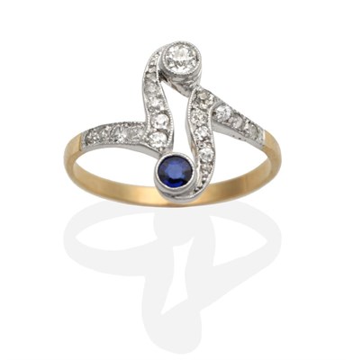 Lot 2150 - A Sapphire and Diamond Ring, a round cut sapphire and an old cut diamond in milgrain settings,...