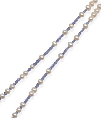 Lot 2153 - A Tanzanite and Cultured Pearl Necklace, faceted tanzanite beads spaced at intervals by...