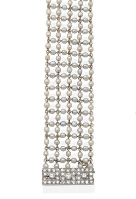 Lot 2161 - An Art Deco Pearl and Diamond Bracelet, five strands of pearl beads, connected by jump rings,...