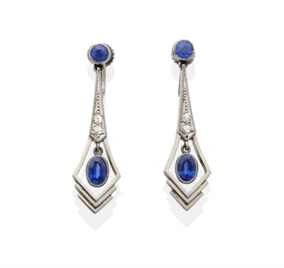 Lot 2165 - A Pair of Sapphire and Diamond Drop Earrings, a round cut sapphire in a milgrain setting suspends a