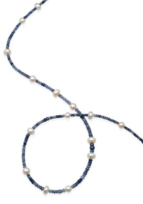 Lot 2180 - A Sapphire and Cultured Pearl Necklace, graduated faceted shaded sapphire beads spaced at intervals