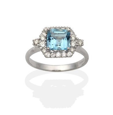 Lot 2181 - An 18 Carat White Gold Aquamarine and Diamond Cluster Ring, an octagonal square cut aquamarine in a