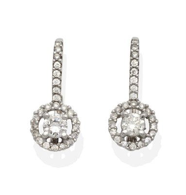 Lot 2184 - A Pair of 18 Carat White Gold Diamond Cluster Earrings, a round brilliant cut diamond in a claw...