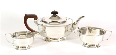 Lot 2232 - An Art Deco Three Piece Silver Tea Service, Adie Bros, Birmingham 1940, oval octagonal form on...