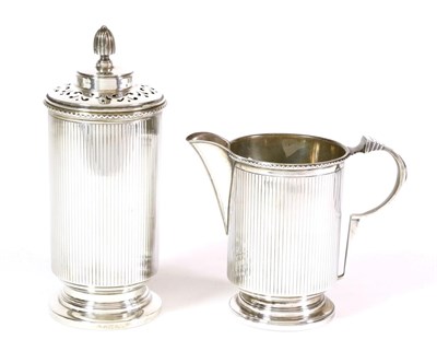 Lot 2285 - An Art Deco Silver Cream Jug and Caster, William Neale Ltd., Birmingham 1938, of cylindrical...