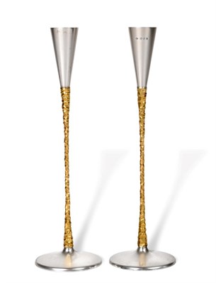 Lot 2287 - Stuart Devlin: A Pair of Parcel Gilt Silver Candlesticks, London 1972, the slender tapering...