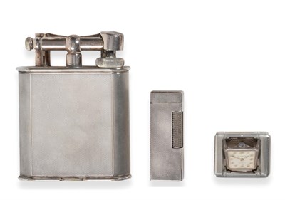 Lot 2312 - Dunhill: A Large Size Engine Turned Silver Plated Table Lighter, mid 20th century, stamped to...