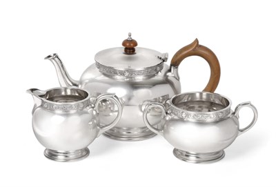 Lot 2361 - A Three Piece Silver Tea Service, Reid & Sons, London 1965, spherical form on short foot, with...