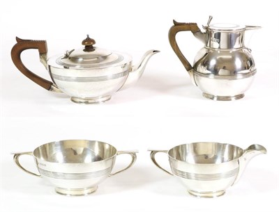 Lot 2397 - An Edwardian Silver Three Piece Tea Service, Edward Souter Barnsley, Birmingham 1909, squat...