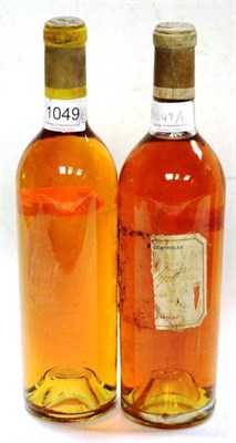 Lot 1049 - Chateau d'Yquem 1950, Sauternes; Chateau d'Yquem 1962, Sauternes (two bottles) U: top shoulder,...