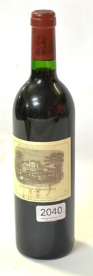 Lot 2040 - Chateau Lafite Rothschild 1983, Pauillac U: into neck, slightly soiled label