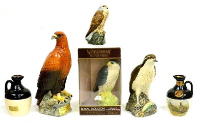 Lot 1312 - Novelty Decanters Including: Beswick Golden Eagle, Whyte & Mackay, Royal Doulton Merlin, etc...