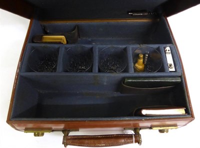 Lot 2396 - A Leather Briefcase 'A Daily Round by Doctor's Orders', the interior fitted to hold two bottles...