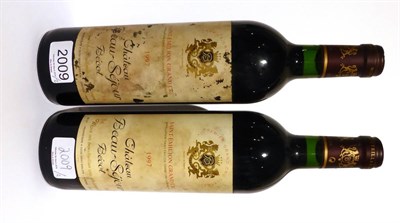 Lot 2009 - Chateau Beausejour 1997, Saint-Emilion Grand Cru (x2) (two bottles) U: into neck, bin soiled labels