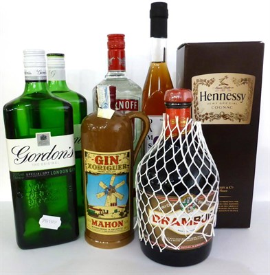 Lot 2201 - A Mixed Parcel Comprising: Smirnoff, litre; Hennessy Very Special, litre; Gordons, litre (x2);...