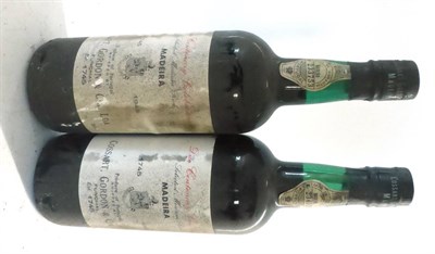 Lot 2358 - Cossart Gordon Madeira Duo Centenary Celebration 1945 (x2) (two bottles) U: into neck, bin...