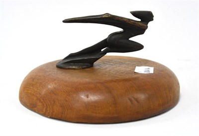 Lot 2004 - An Art Deco Bronze Car Mascot, modelled as a nude female with wings outstretched, raised on a later