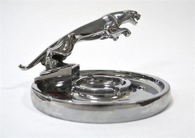 Lot 2005 - A 1950s Jaguar Chrome Car Mascot, mounted on a circular chrome ashtray base, 17.5cm diameter...