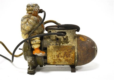 Lot 2010 - A Vintage Michelin Tyre Compressor, in the shape of an artillery shell surmounted by a cast...
