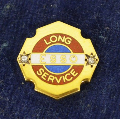 Lot 2026 - A 9ct Gold and Enamel Lapel Pin, stamped Esso Long Service, with two small diamond chips, the verso