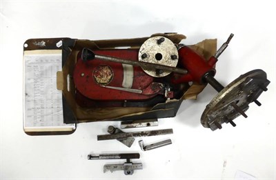 Lot 2043 - A Black Hawk Wheel Balancer, painted red, with Assorted tools and reference papers for Austin,...