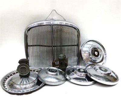 Lot 2045 - A Vintage Jaguar Chromed Car Radiator Grill, Three Vintage Jaguar 10½ inch Chrome Wheel Hubs,...