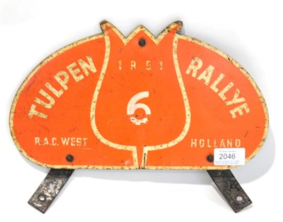 Lot 2046 - An Orange Enamel Advertising Sign 'TULPEN RALLYE 1951 RAC West Holland', with metal mounting...