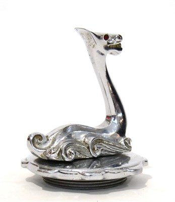 Lot 2101 - A Chrome Car Mascot in the form of the Loch Ness Monster, red garnet eyes, stylised scroll...