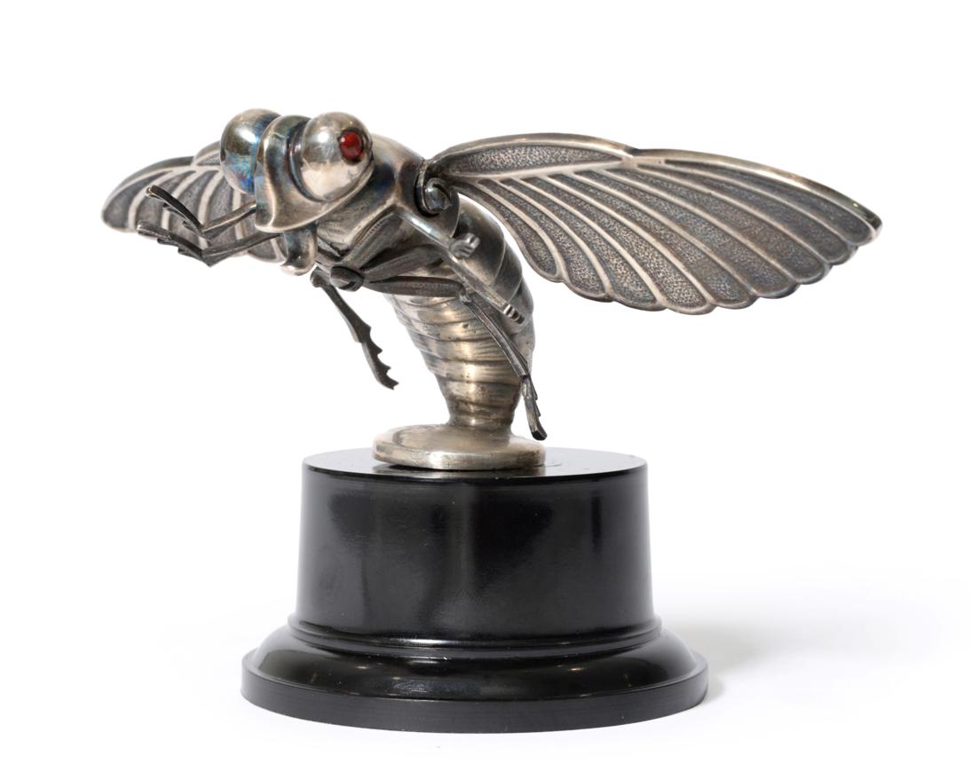 Lot 2135 - A Rare Nickel Plated Car Mascot in the form of a Hornet, with garnet set eyes, the base stamped...