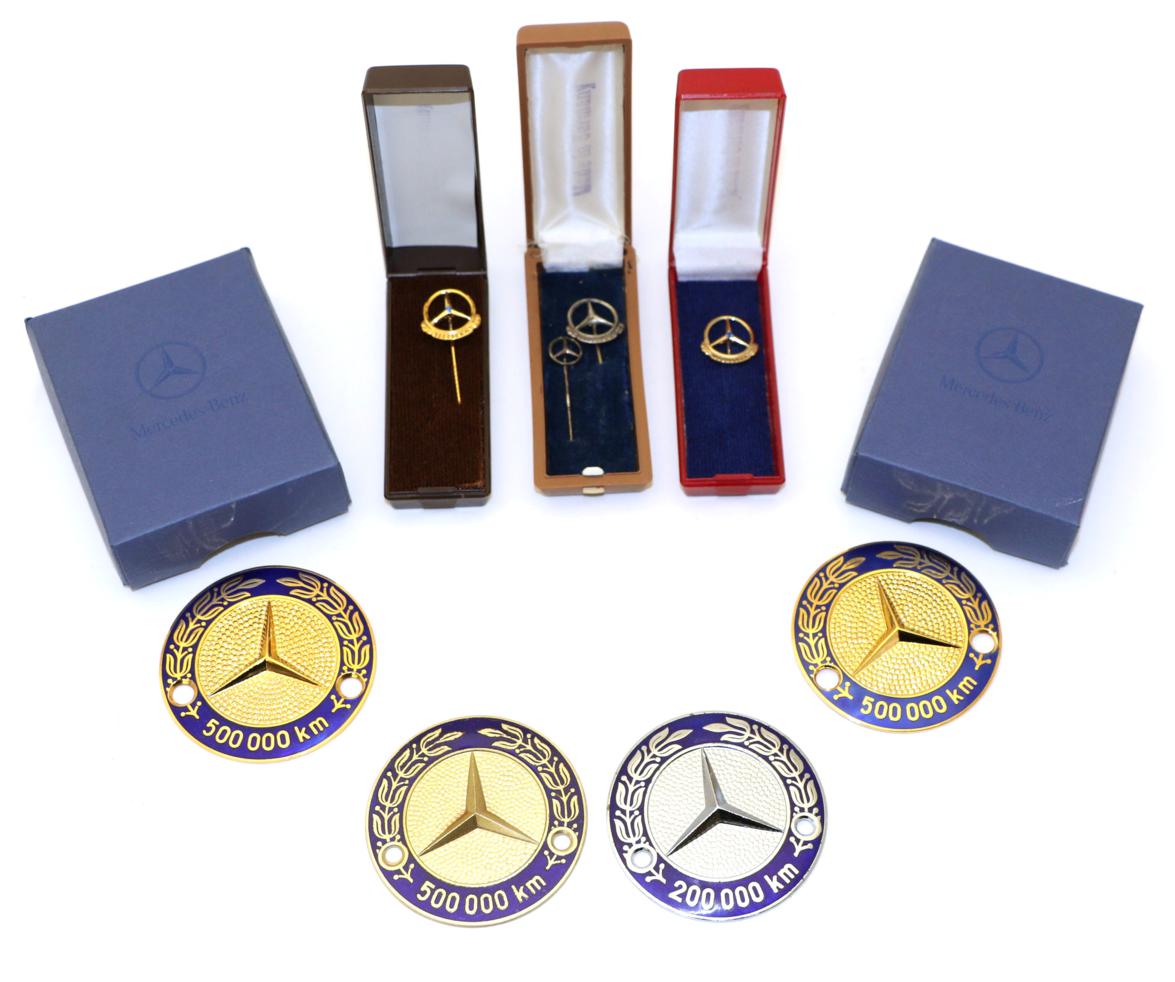 Lot 2035 - Mercedes Benz Interest: Three blue enamel and gilt decorated high mileage badges for 500,000km...
