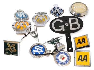 Lot 2037 - A 1920s AA GB Car Badge, with mounting bracket, 18cm wide; and Eleven Assorted Car Badges, to...
