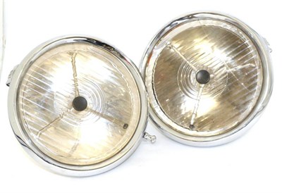 Lot 2045 - A Pair of 1920/30 Lucas P100S Headlamps, with chrome bodies, mounting brackets and bull's eye...
