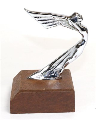 Lot 2107 - A 1930s Chrome Plated Car Mascot Modelled as a Stylised Winged Goddess, raised on a wooden...