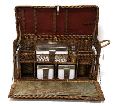 Lot 1002 - A 1920/30s Wicker Picnic Set, with hinged lid and fall front enclosing enamel and chromium...