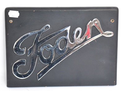 Lot 1006 - A Chromed Radiator Badge for a Foden Lorry, mounted on an ebonised wooden board with drill...