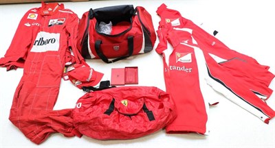 Lot 1008 - A Ferrari F1 Team Kit Bag, comprising a holdall, a red leather mobile phone case, boxed, two...