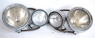 Lot 1016 - A Pair of 5in Chrome Spot Lamps; and a pair of 7in chrome headlamps on metal mounting brackets (4)
